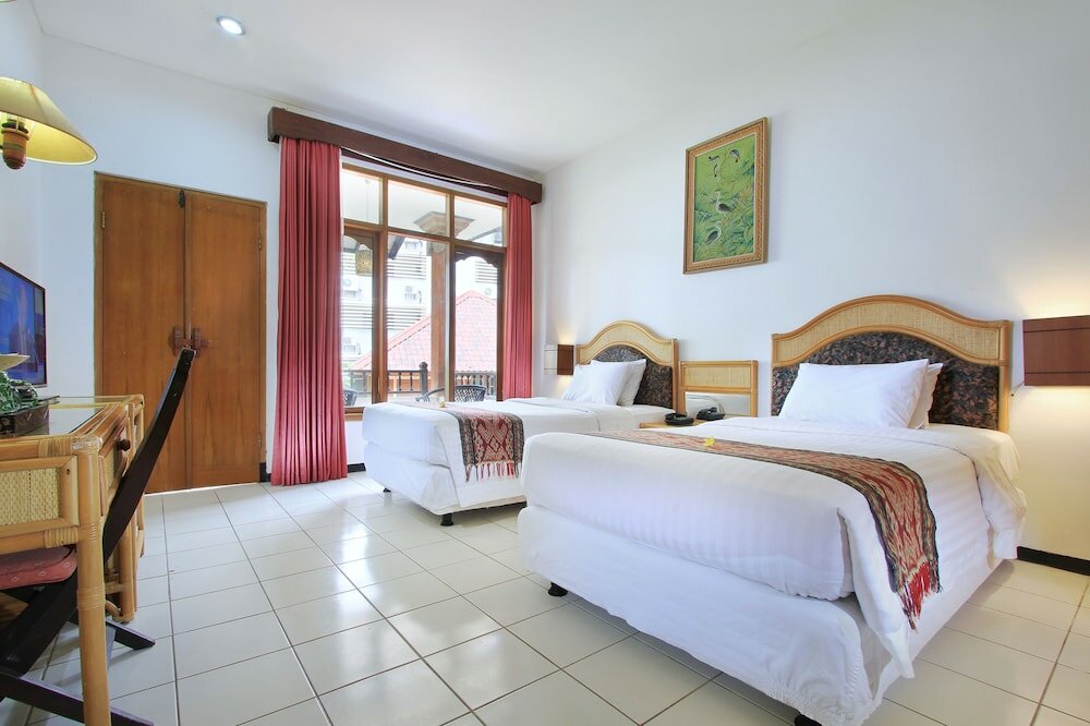 Фото Puri Naga Beachfront Cottages