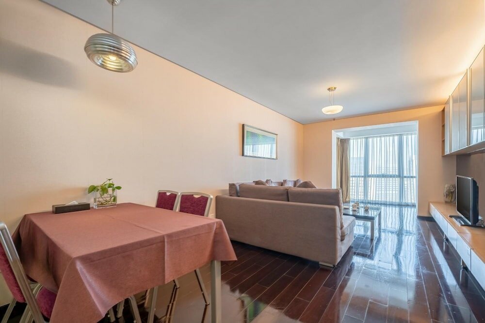 Фото Qingdao Housing International Hotel