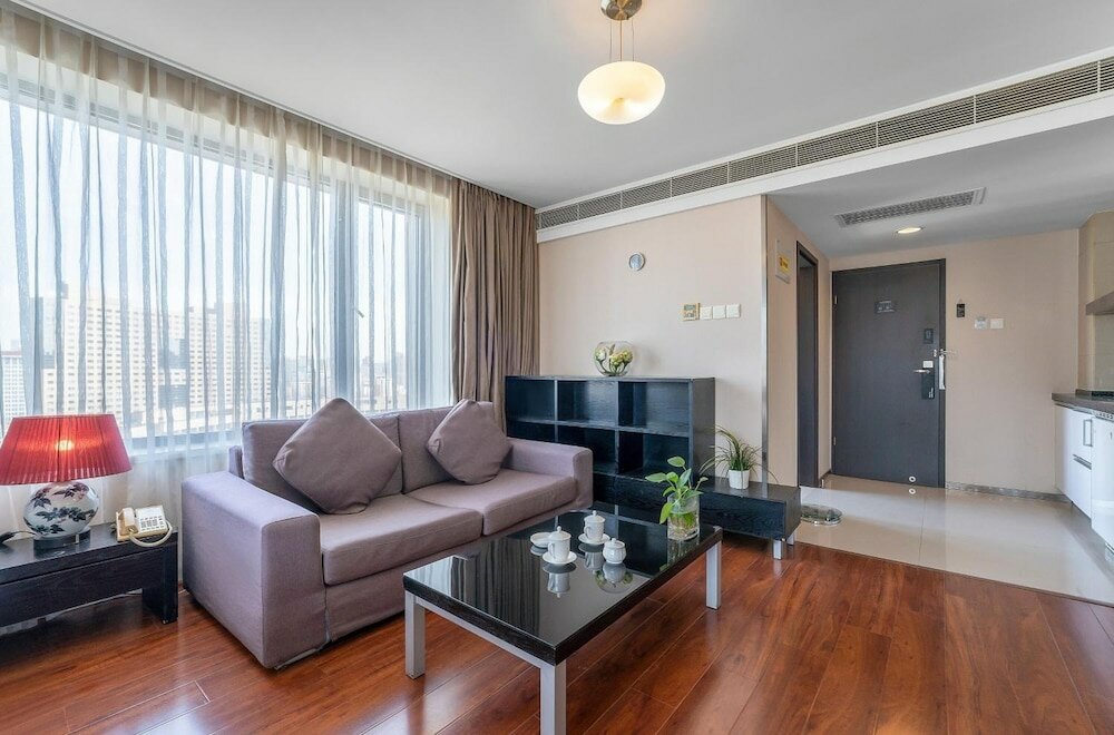 Фото Qingdao Housing International Hotel