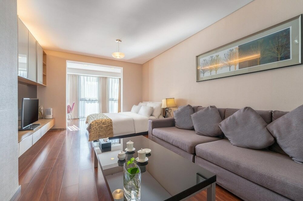 Фото Qingdao Housing International Hotel