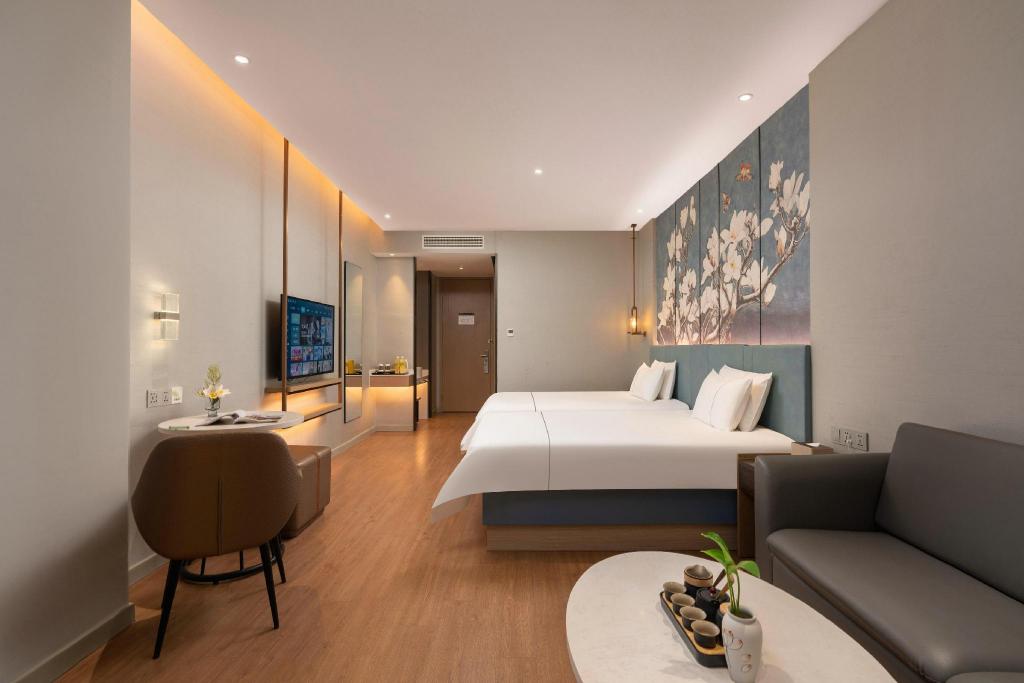 Фото Magnotel Jining Jiaxiang, Zengzi Avenue Hotel