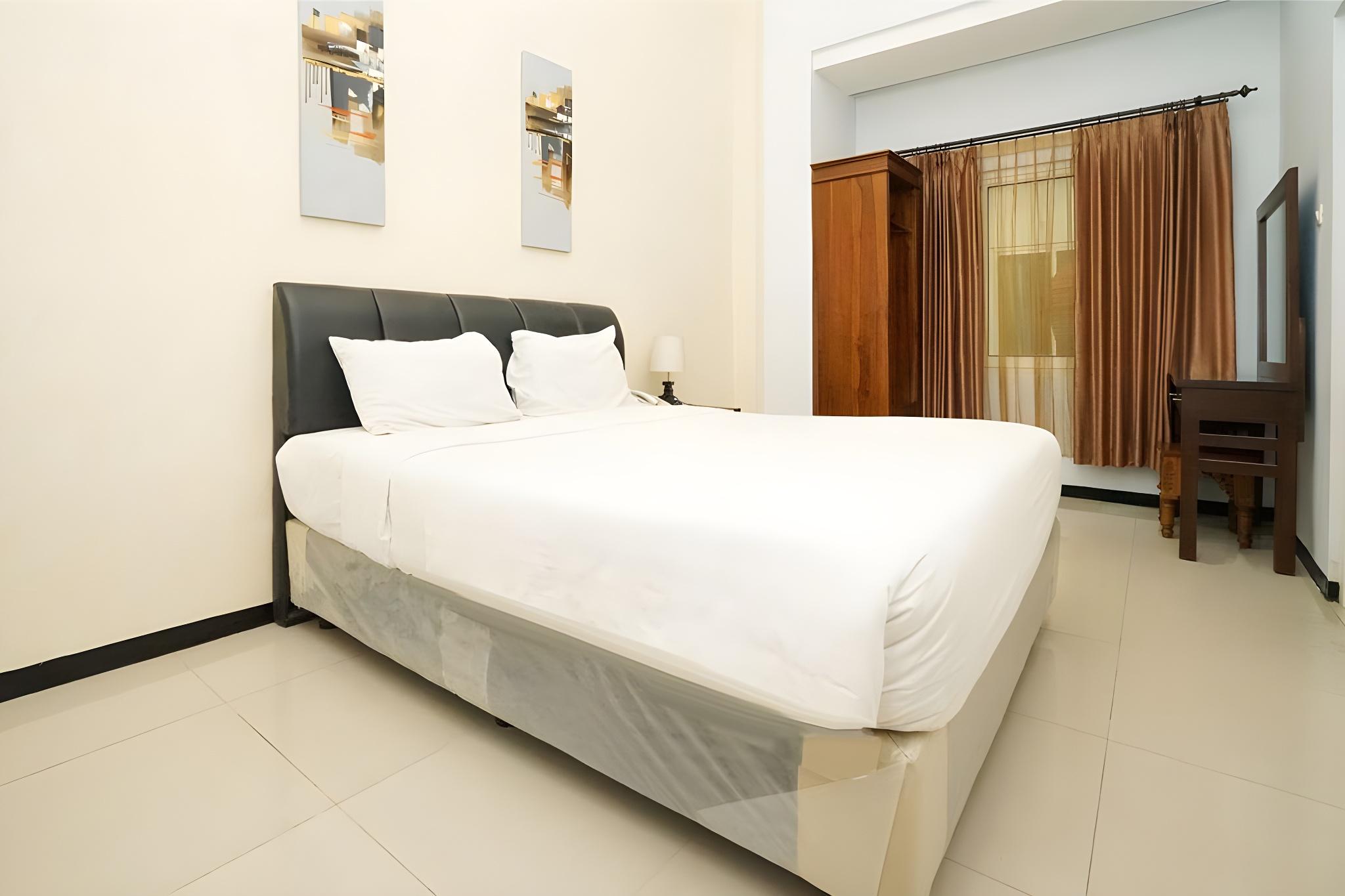 Фото Oyo 282 Putri Utari Guest House