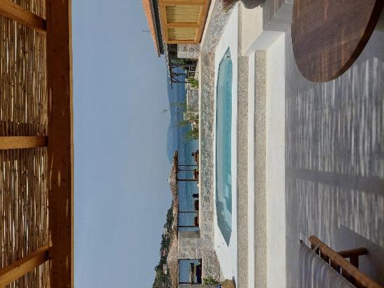 Фото Mandraki Beach Resort - Adults Only