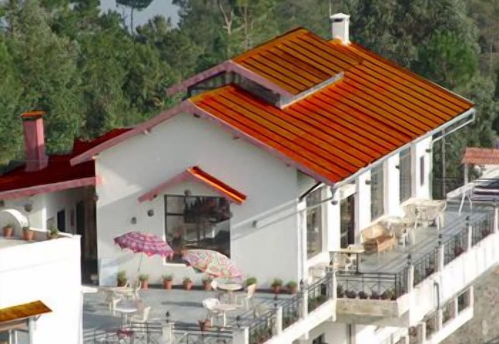 Фото Woodsvilla Resort