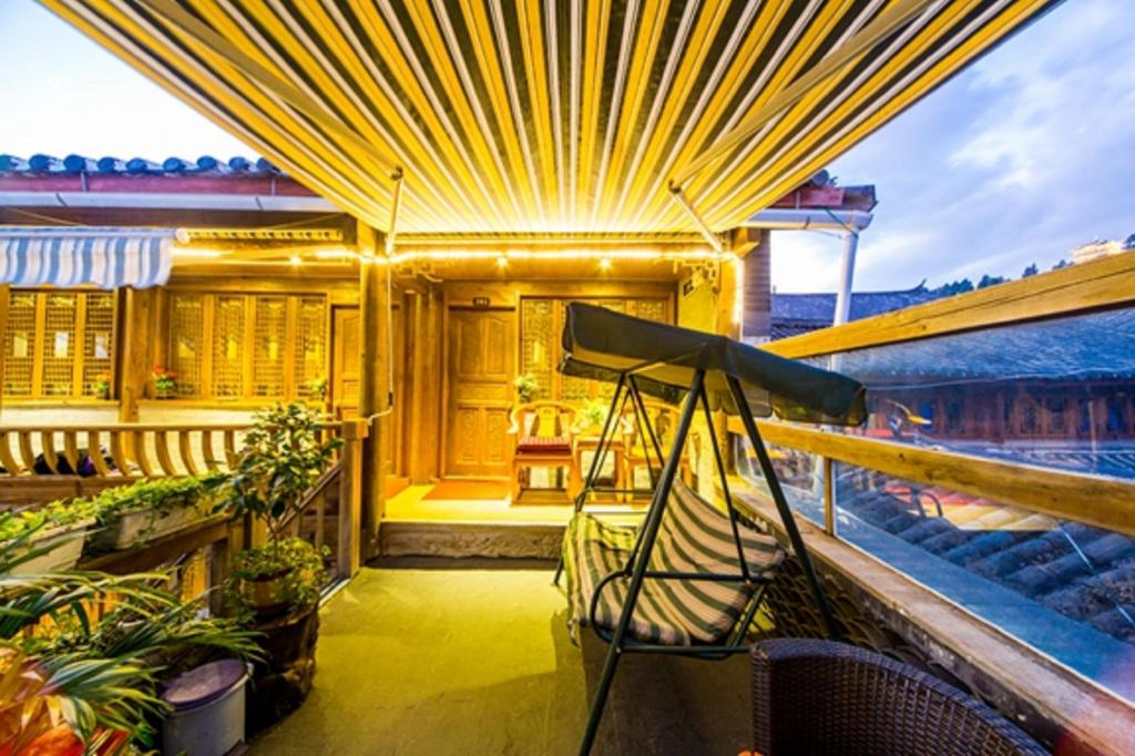 Фото Li Jiang Hemuju Inn