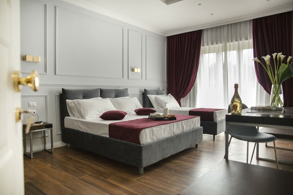 Фото Unicum Roma Suites