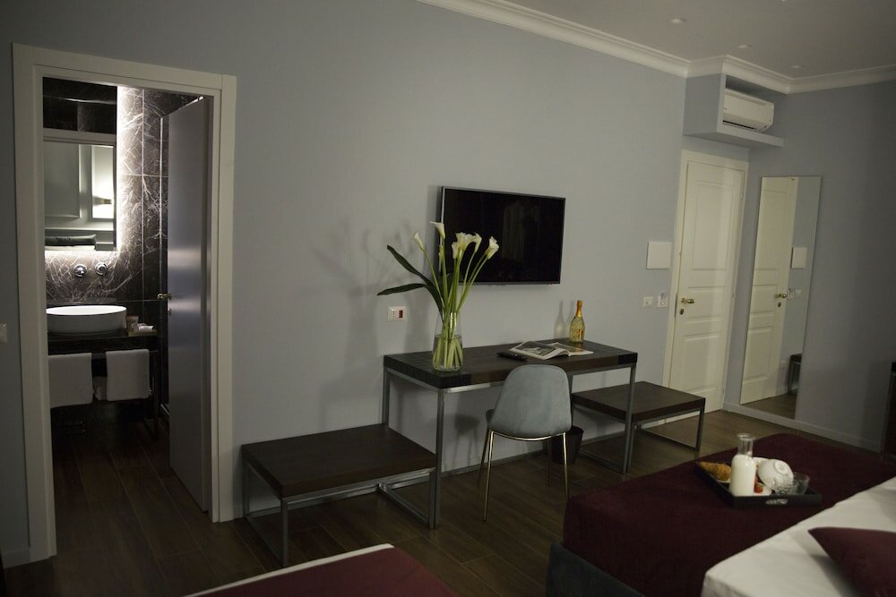 Фото Unicum Roma Suites