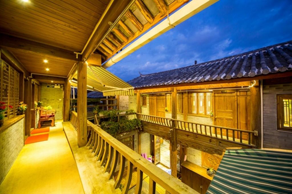 Фото Li Jiang Hemuju Inn