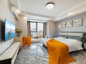 Tuyuan Holiday Apartment (Room 2188, Tower B, South Building, Zhihui Center, No. 19, Letian Century City, Qingdao Middle Road), hotel