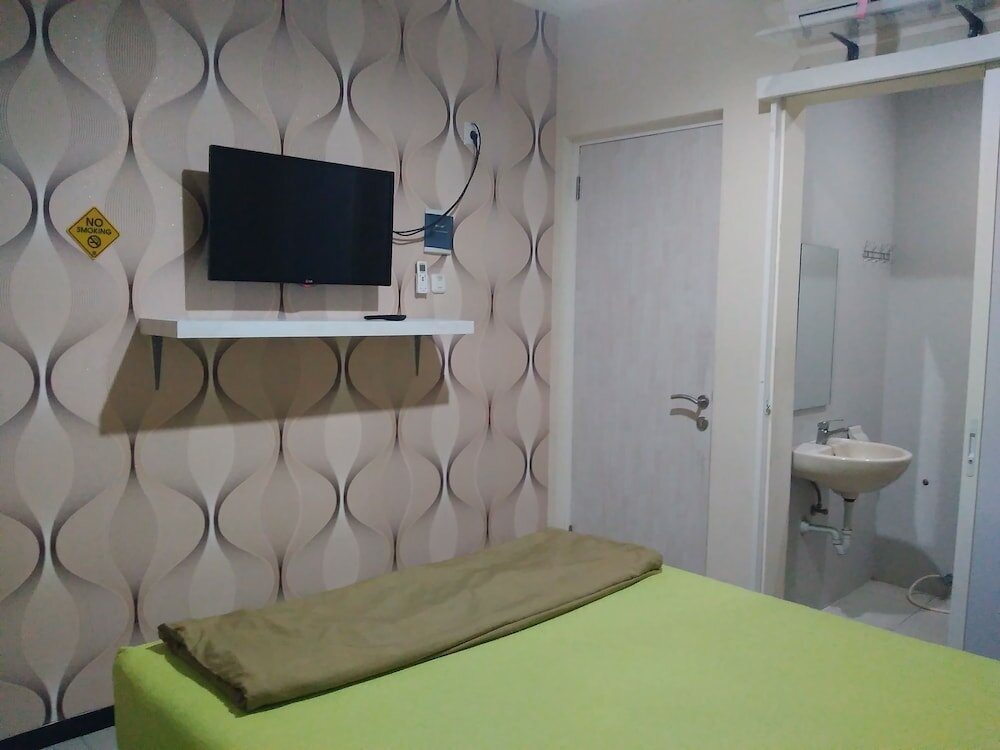 Фото Budget Guest House Tunas Mandiri Jaya