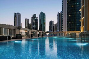 отель Wyndham Grand Doha West Bay Beach
