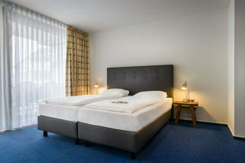 Гостиница Novum Hotel Strohgäu в Дитцингене