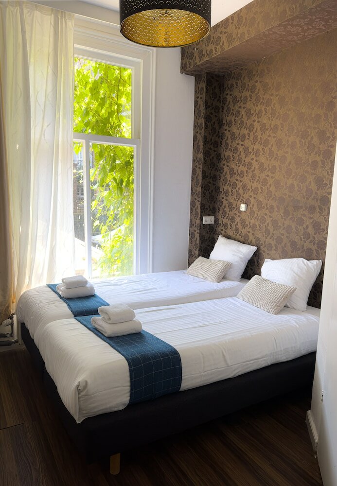 Фото Amsterdam Inn Hotel