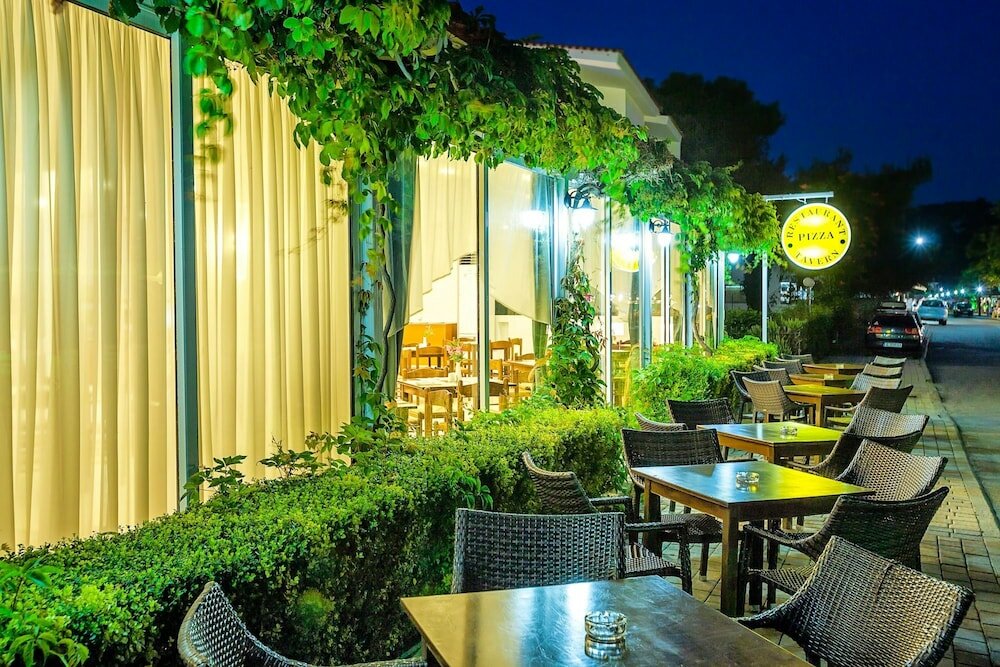 Фото Xenios Dolphin Beach Hotel