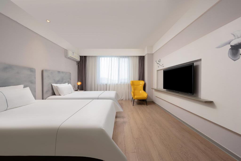 Фото Magnotel Jining Jiaxiang, Zengzi Avenue Hotel