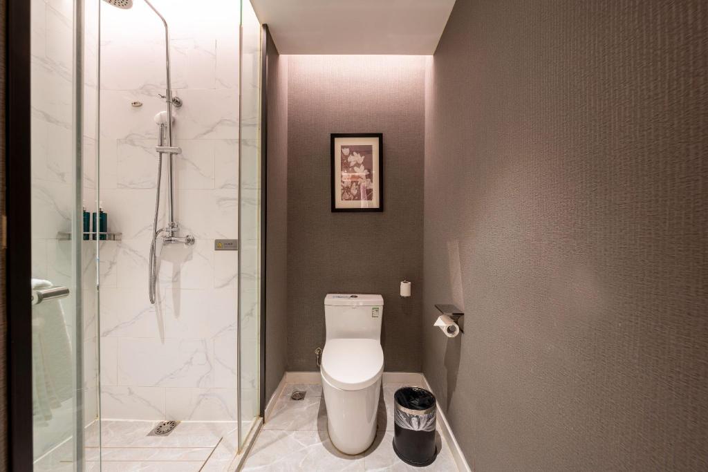 Фото Magnotel Jining Jiaxiang, Zengzi Avenue Hotel