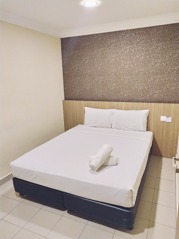 Фото Oyo 615 Dragon Inn Premium Hotel