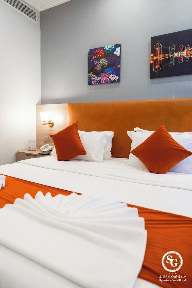 Фото Signature Guest Hotel