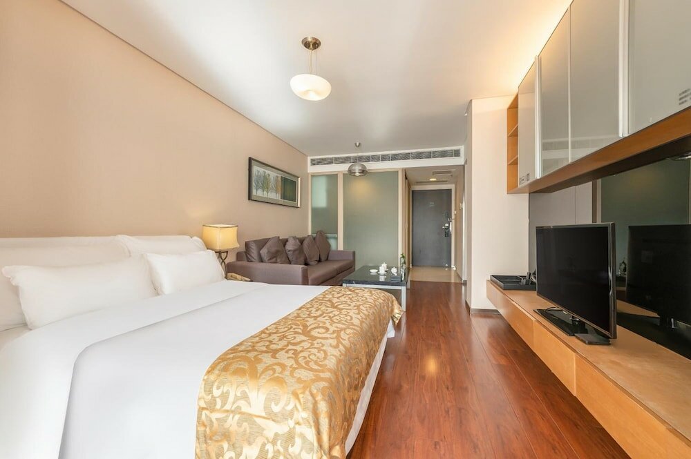 Фото Qingdao Housing International Hotel