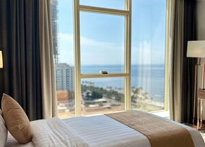 Гостиница Seafront Luxury Suites