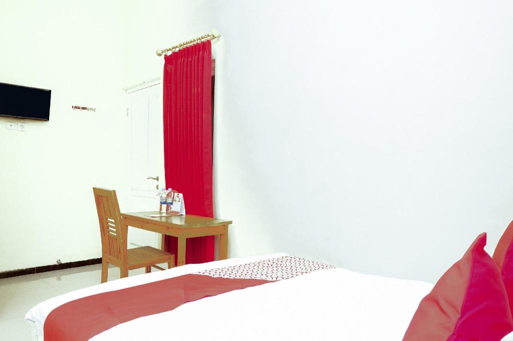 Фото Oyo 314 Emas 23 Guest House Syariah