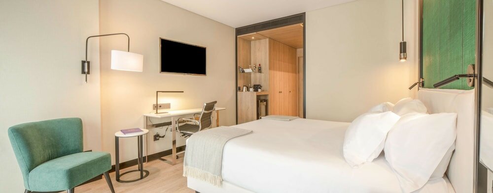 Фото Nh Hotel Porto Jardim