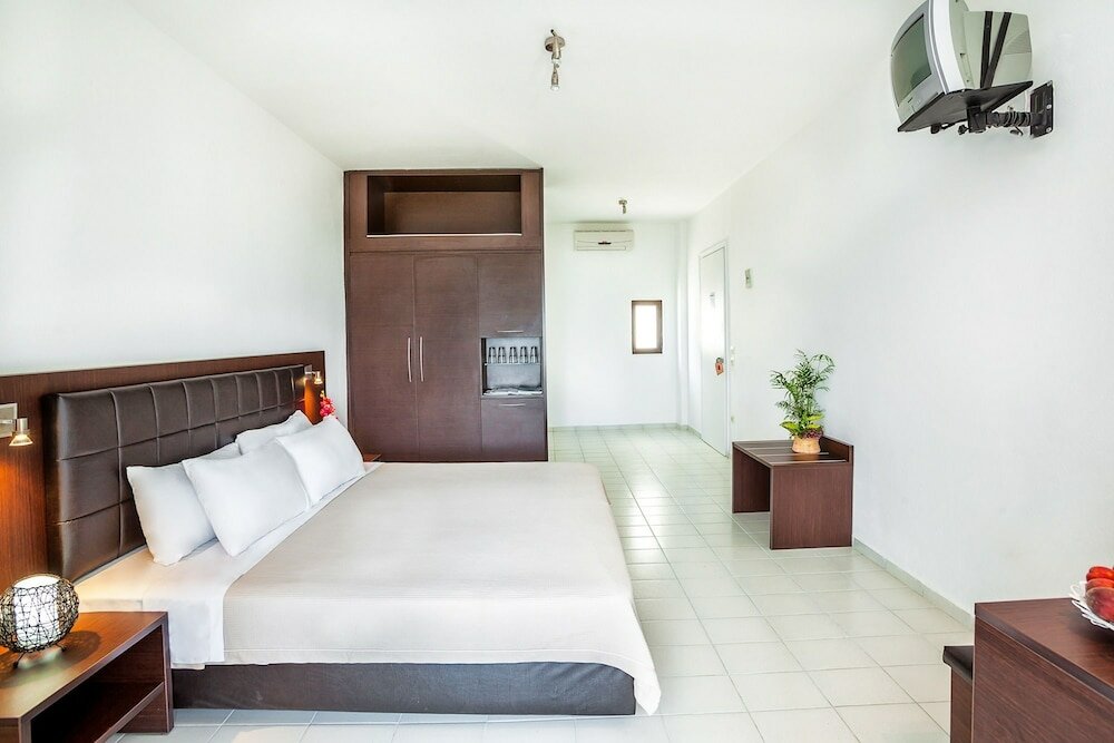 Фото Xenios Dolphin Beach Hotel