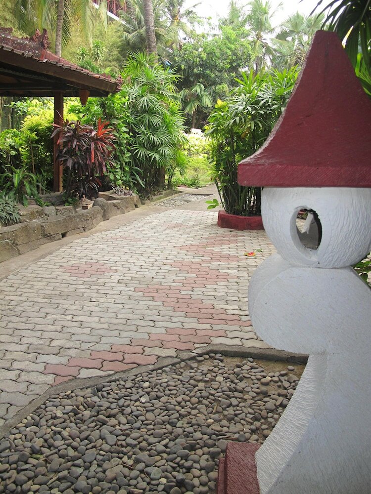 Фото Puri Naga Beachfront Cottages