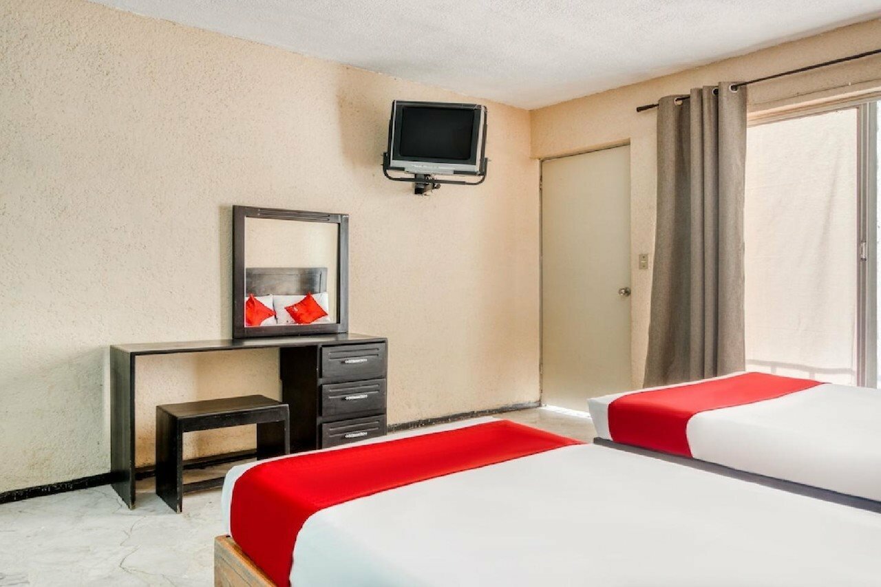 Фото Capital O Hotel La Siesta, Gómez Palacio