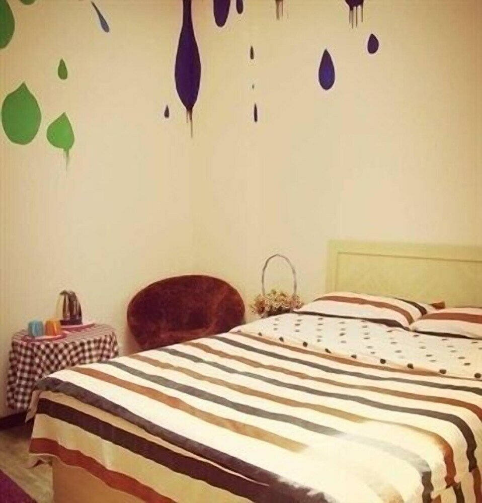 Фото Qingdao Yuezhu Topic Hostel