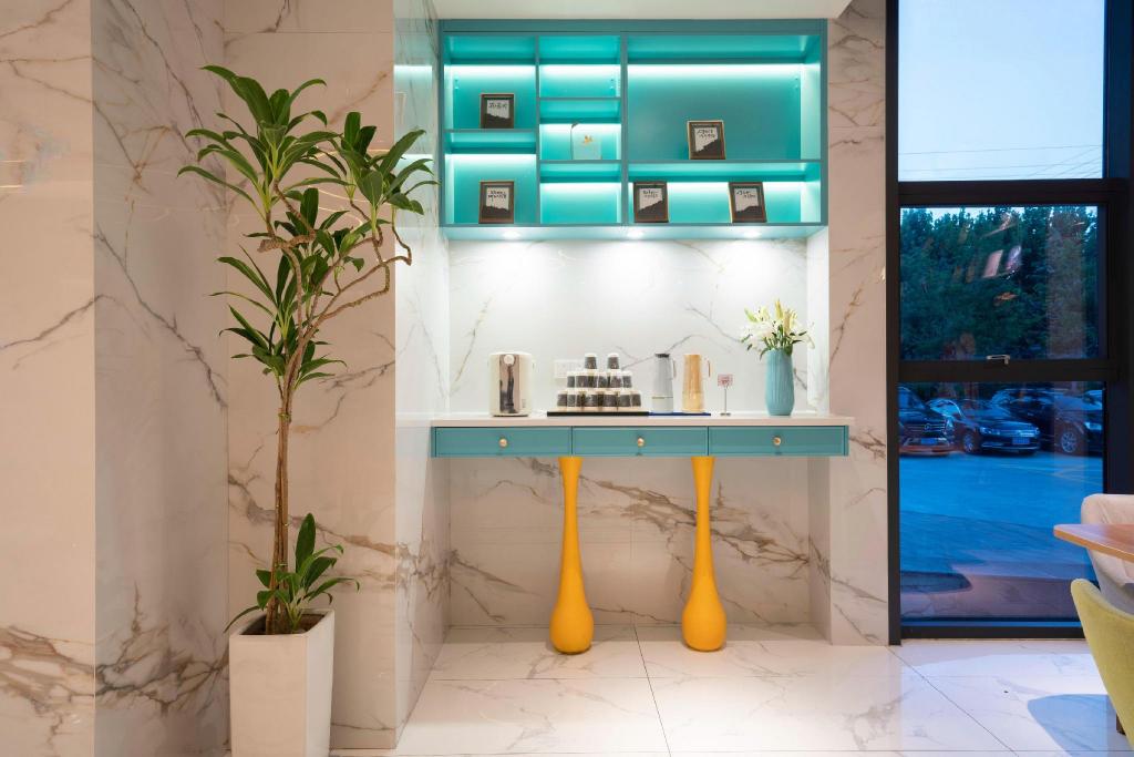 Фото Magnotel Jining Jiaxiang, Zengzi Avenue Hotel