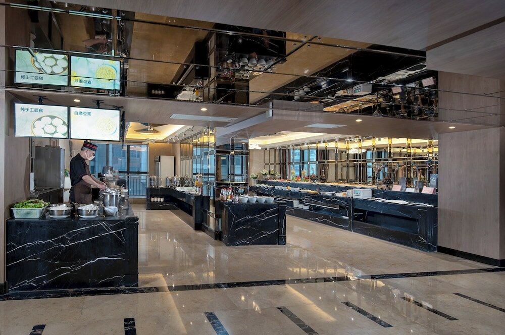 Фото Fuqinglong Huatian Holiday Hotel