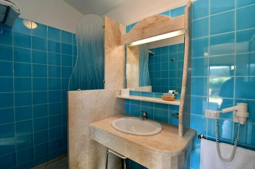 Гостиница Li Suari Club Village в Сардинии