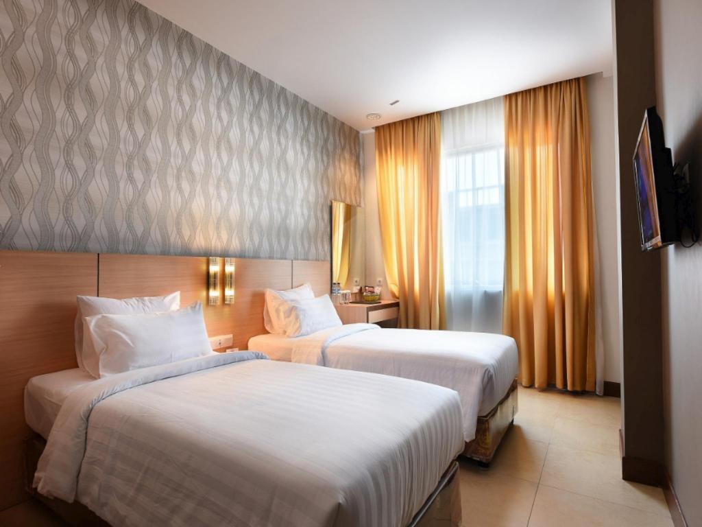 Фото Grand Impression Hotel Medan