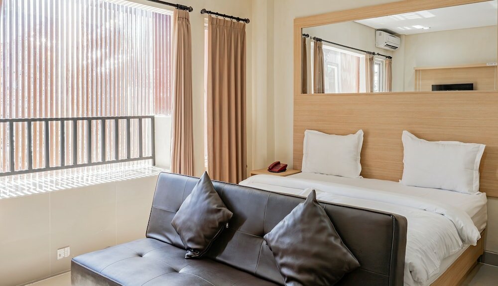 Фото Kuta Airport Insta Hotel