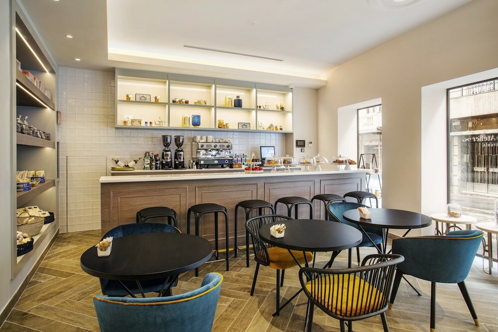 Фото Eurostars Puerta Real Hotel