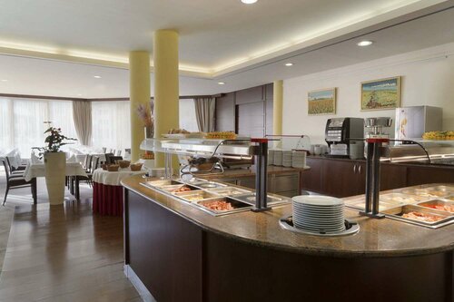 Гостиница Ramada Hotel & Suites by Wyndham Kranjska Gora в Краньска-Горе