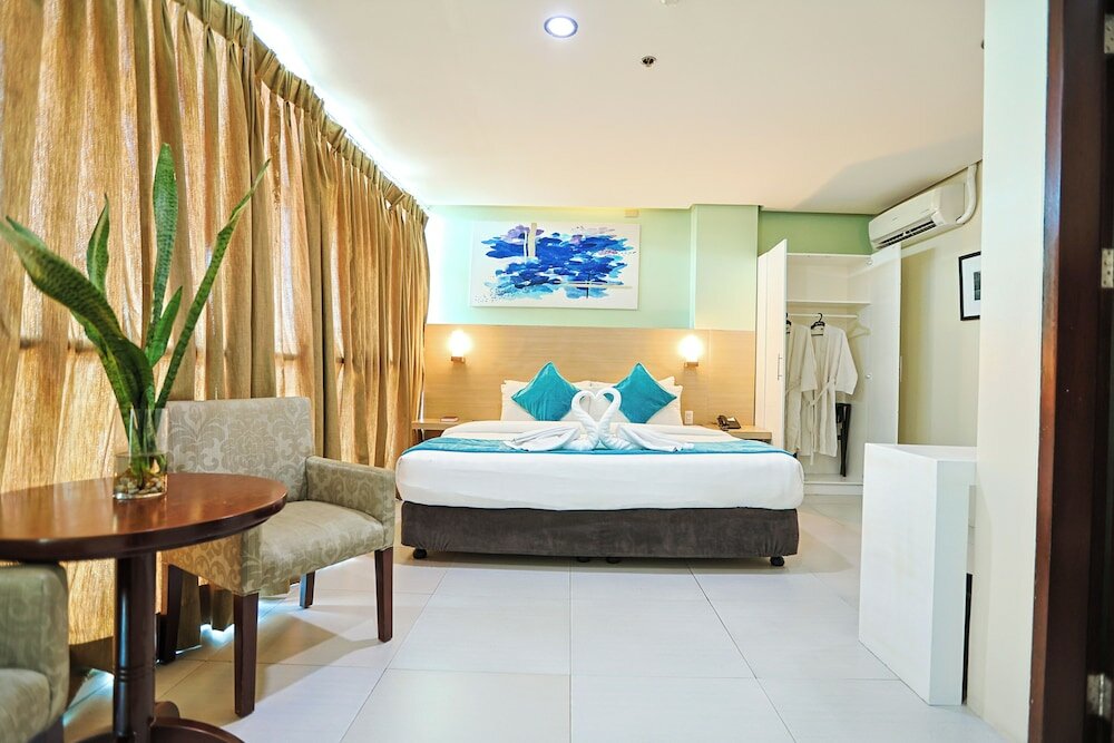 Фото Empire Suites Hotel