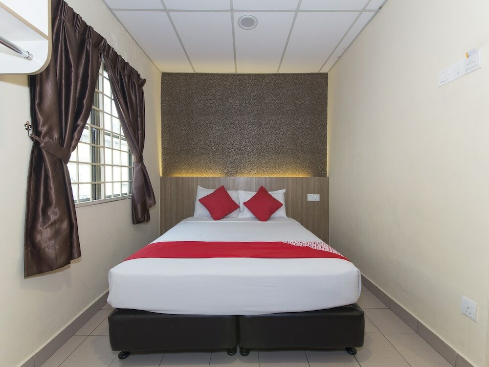 Фото Oyo 615 Dragon Inn Premium Hotel