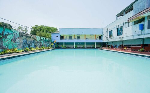 Гостиница Oyo 1652 Hotel Tampiarto в Проболинго