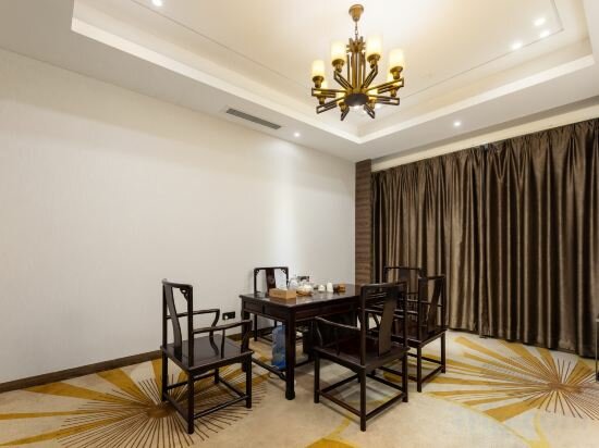 Фото Auden International Hotel