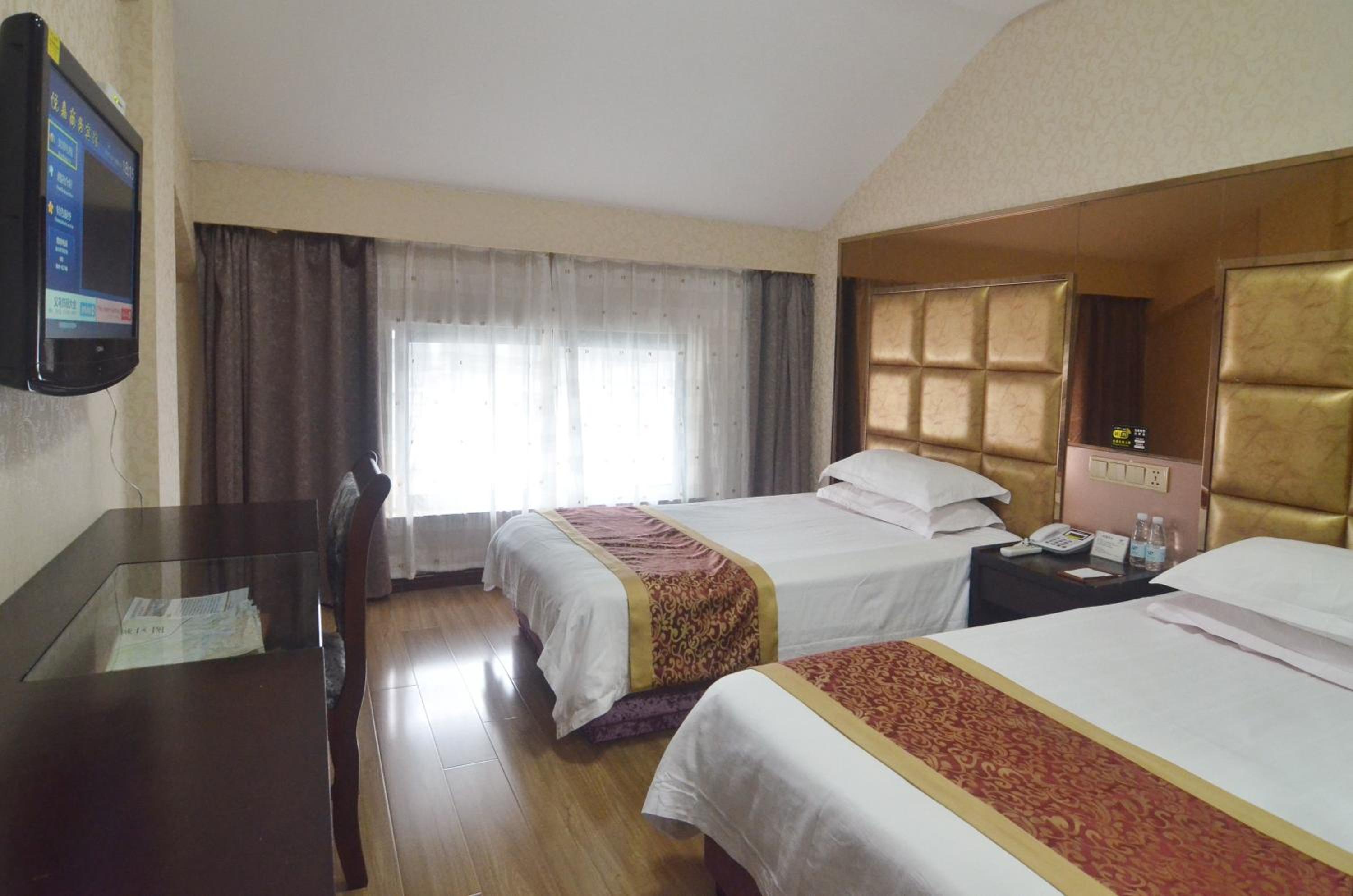 Фото Yiwu Yuejia Hotel