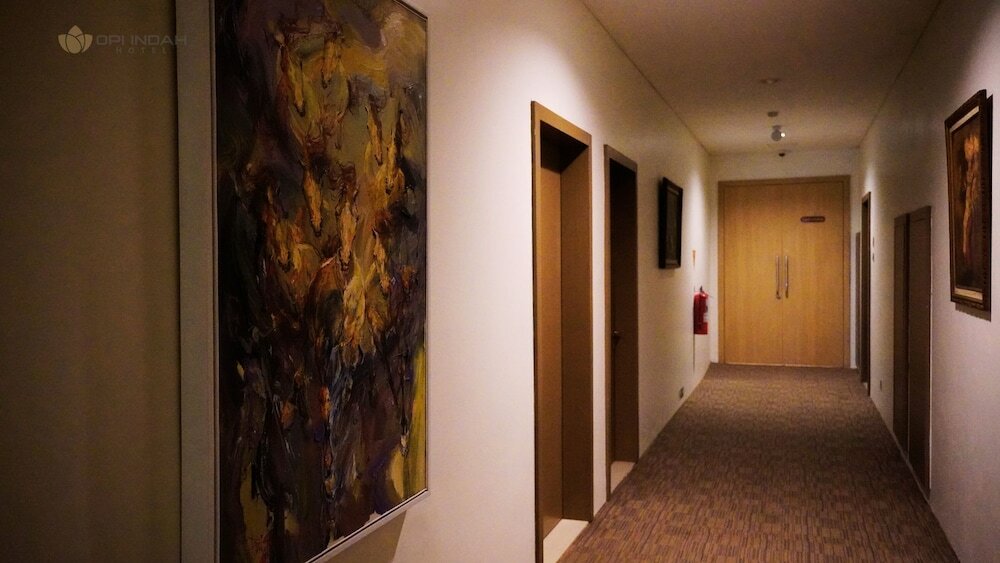 Фото Opi Indah Hotel