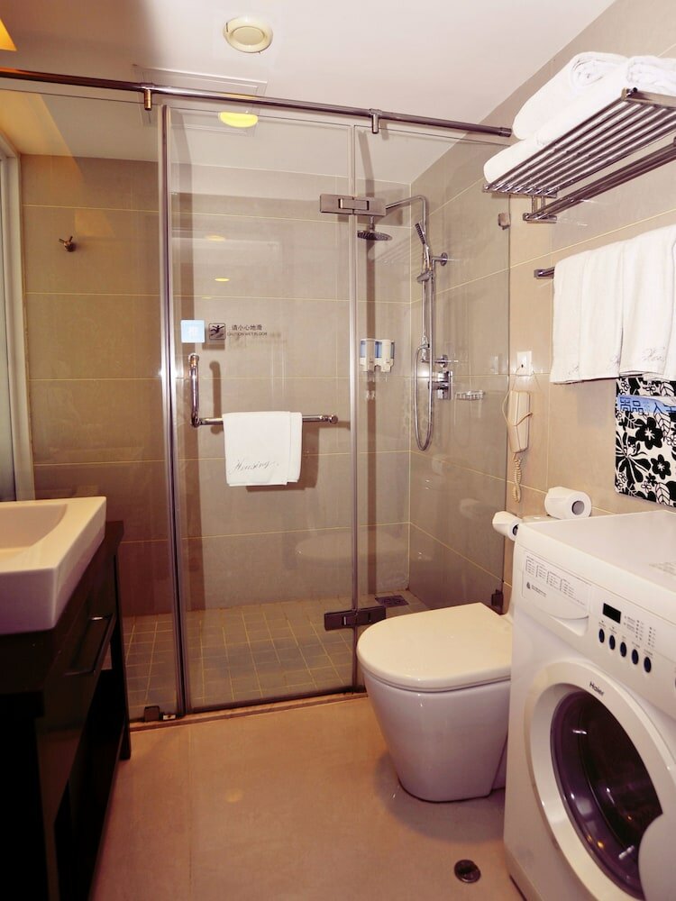 Фото Qingdao Housing International Hotel