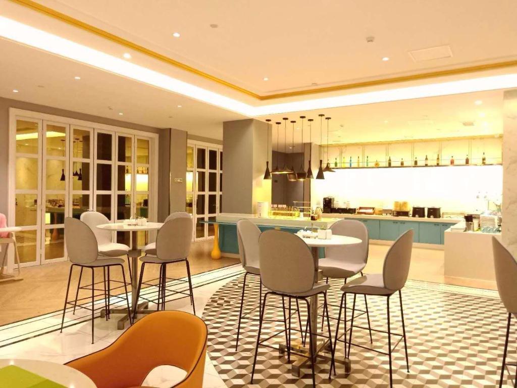 Фото Magnotel Jining Jiaxiang, Zengzi Avenue Hotel