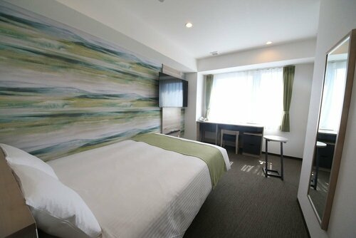 Гостиница Kuretake Inn Premium Numazu Kitaguchi Ekimae в Нумадзу