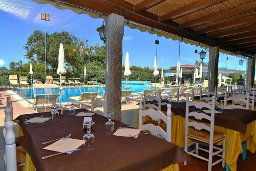 Гостиница Li Suari Club Village в Сардинии