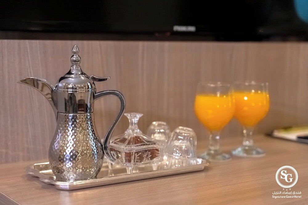 Фото Signature Guest Hotel