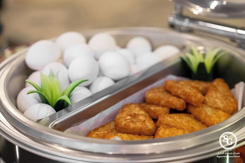 Фото Signature Guest Hotel