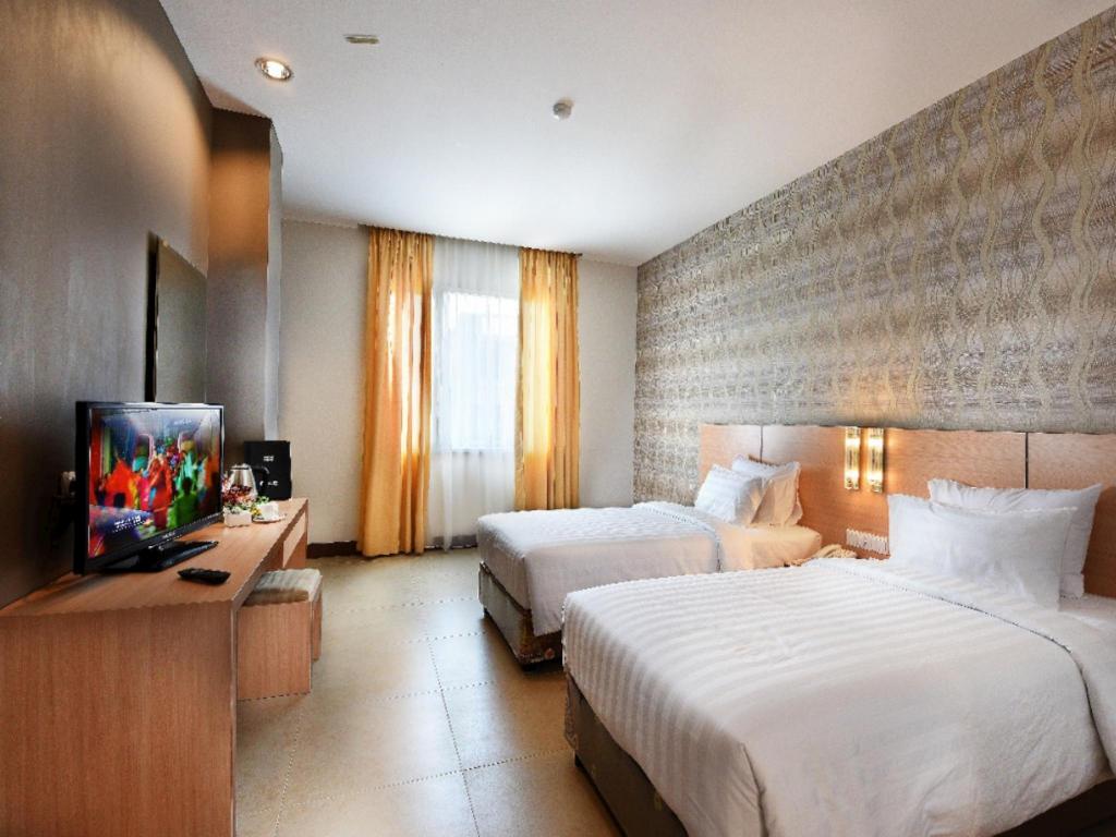 Фото Grand Impression Hotel Medan